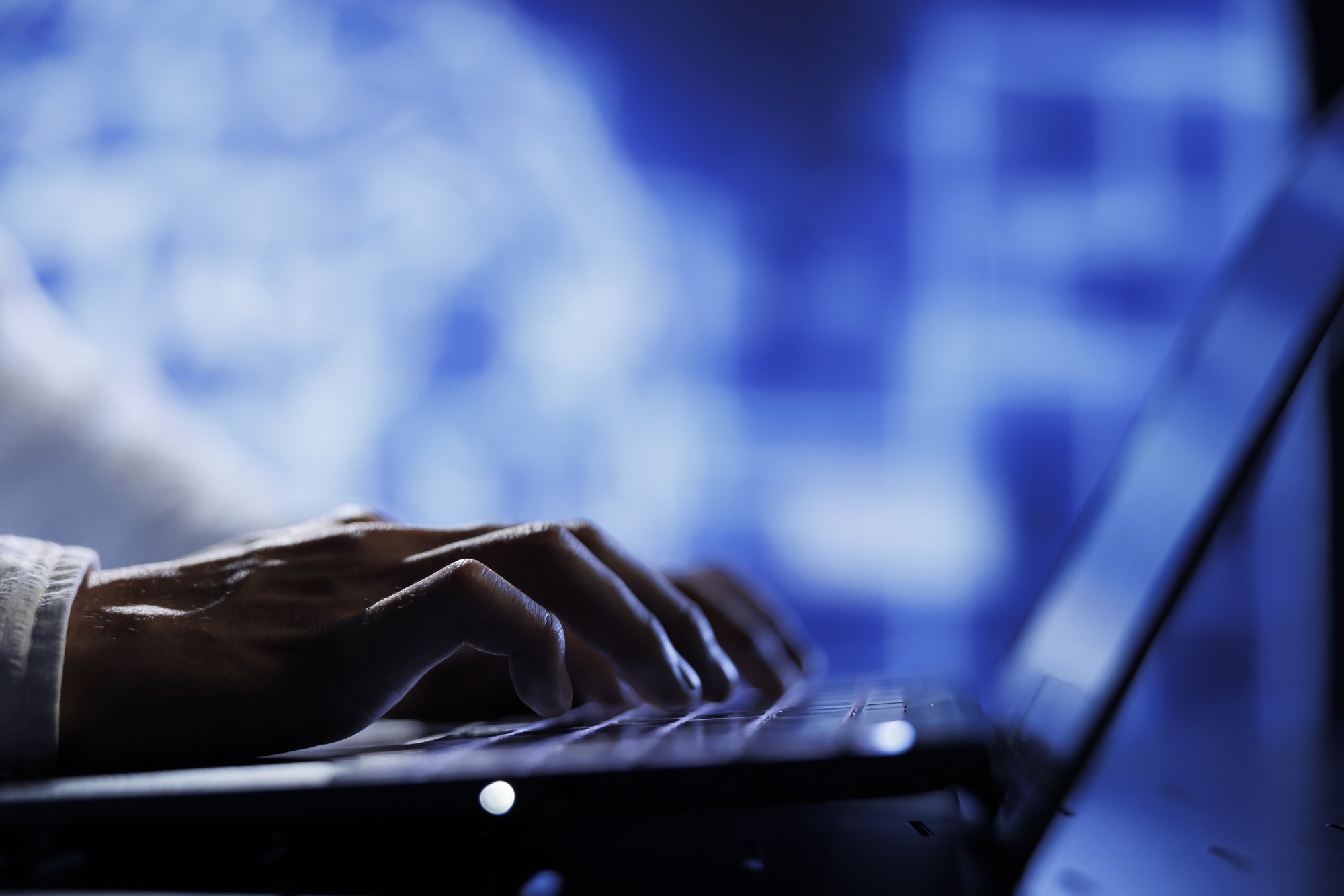 computer-operator-using-laptop-maintenance-artificial-intelligence-neural-networks-simulating-human-thought-processes-computerized-model-tech-support-doing-checkup-ai-systems-close-up