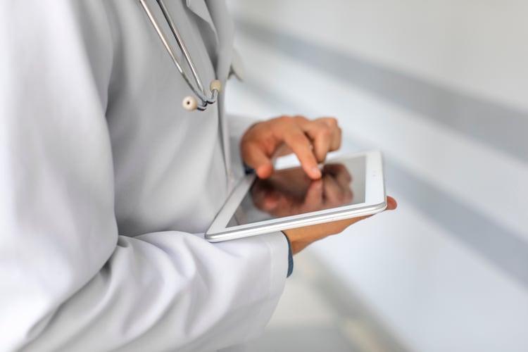 doctor using a tablet