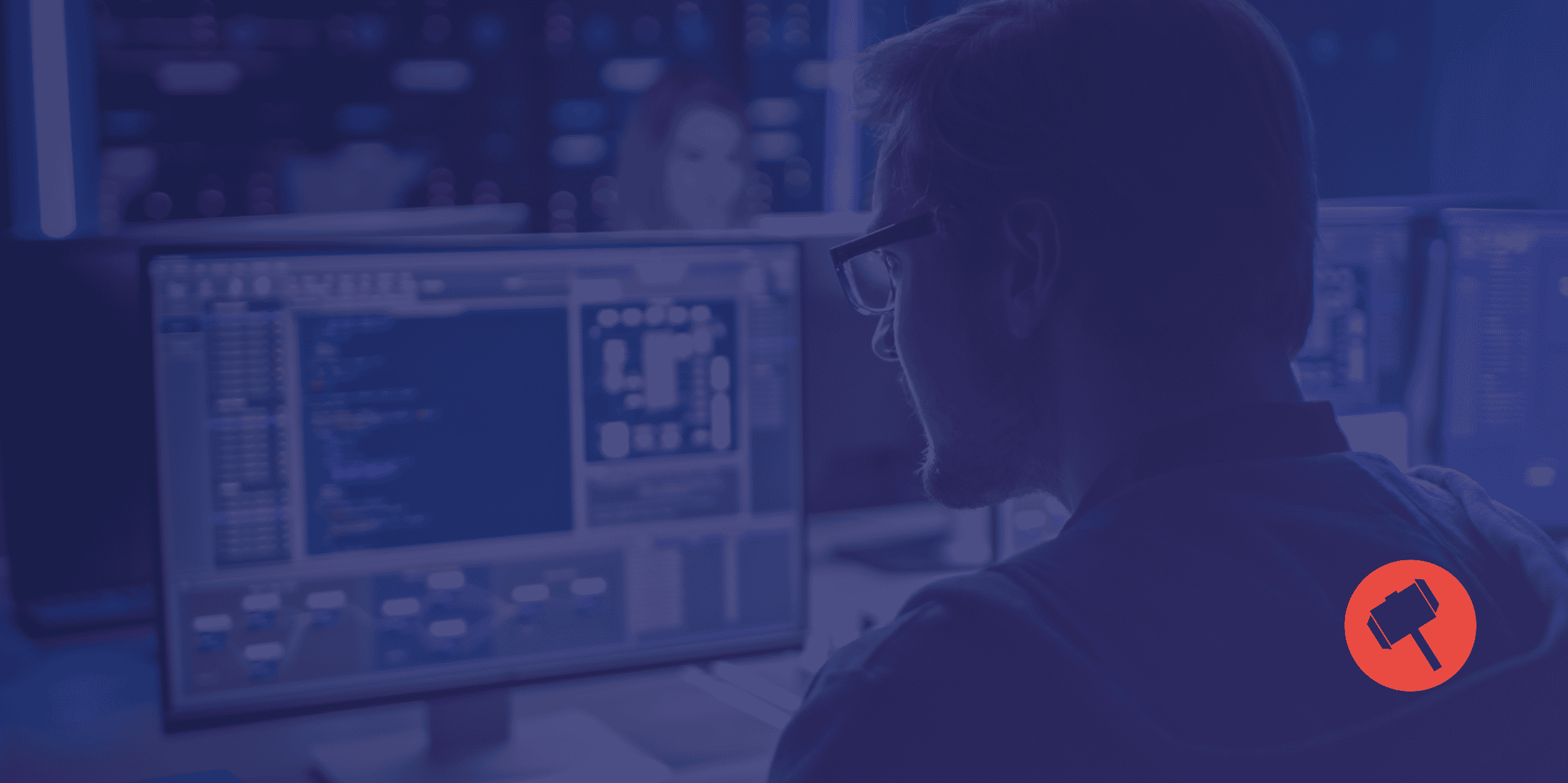Someone looking at their computer, reviewing security events. MDR vs SIEM vs MSSP. By RedLegg.